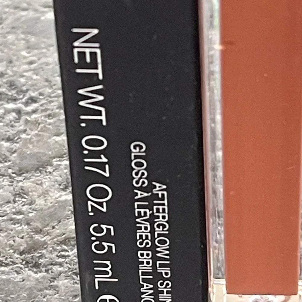NARS Afterglow Lip Balm in Laguna, a sheer bronze with gold shimmer